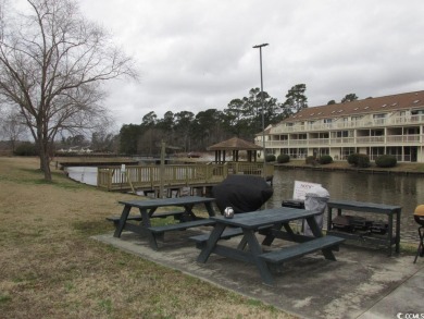 This top floor, end unit, 2BR/2BA condominium at Island Green on Island Green Golf Club in South Carolina - for sale on GolfHomes.com, golf home, golf lot