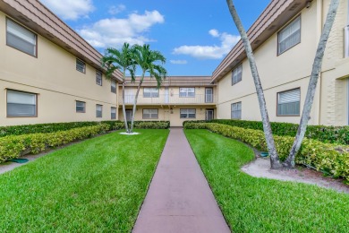 Beautiful well-kept ground floor garden view 2 bed/ 2 bath unit on Addison Reserve in Florida - for sale on GolfHomes.com, golf home, golf lot