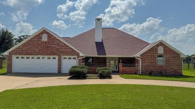 This exceptionally-updated 3 bedroom, 3 bathroom brick home in on Cedar Creek Country Club in Texas - for sale on GolfHomes.com, golf home, golf lot