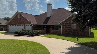 This exceptionally-updated 3 bedroom, 3 bathroom brick home in on Cedar Creek Country Club in Texas - for sale on GolfHomes.com, golf home, golf lot