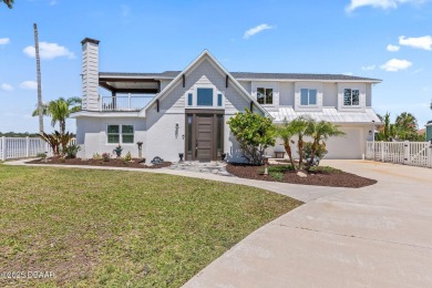 Experience the best of Florida living in this stunning two-story on Ocean Palm Golf Course in Florida - for sale on GolfHomes.com, golf home, golf lot