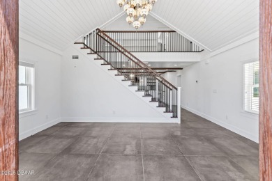 Experience the best of Florida living in this stunning two-story on Ocean Palm Golf Course in Florida - for sale on GolfHomes.com, golf home, golf lot