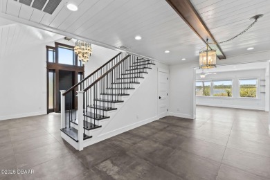 Experience the best of Florida living in this stunning two-story on Ocean Palm Golf Course in Florida - for sale on GolfHomes.com, golf home, golf lot