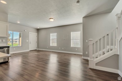 Enjoy laminate floors, an open kitchen with quartz counters on The Ranches Golf Club in Utah - for sale on GolfHomes.com, golf home, golf lot