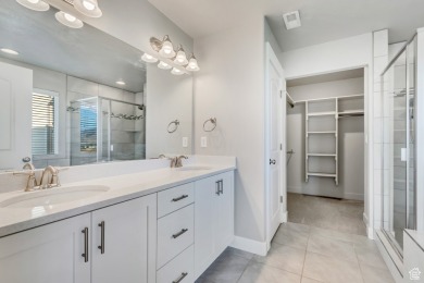 Enjoy laminate floors, an open kitchen with quartz counters on The Ranches Golf Club in Utah - for sale on GolfHomes.com, golf home, golf lot