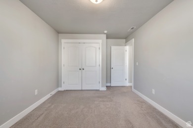 Enjoy laminate floors, an open kitchen with quartz counters on The Ranches Golf Club in Utah - for sale on GolfHomes.com, golf home, golf lot