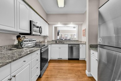 This beautiful condo has it all!  Two primary suites both with on Pawleys Plantation Golf and Country Club in South Carolina - for sale on GolfHomes.com, golf home, golf lot