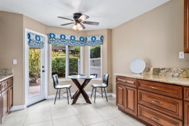 The open-concept family and dining area creates a welcoming on Ocean Hills Country Club in California - for sale on GolfHomes.com, golf home, golf lot