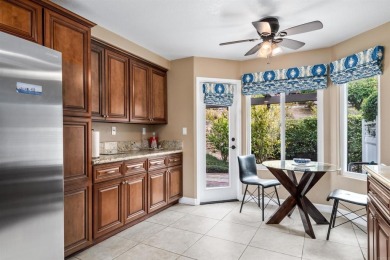 The open-concept family and dining area creates a welcoming on Ocean Hills Country Club in California - for sale on GolfHomes.com, golf home, golf lot