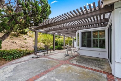 The open-concept family and dining area creates a welcoming on Ocean Hills Country Club in California - for sale on GolfHomes.com, golf home, golf lot