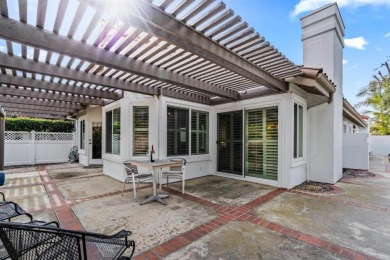 The open-concept family and dining area creates a welcoming on Ocean Hills Country Club in California - for sale on GolfHomes.com, golf home, golf lot