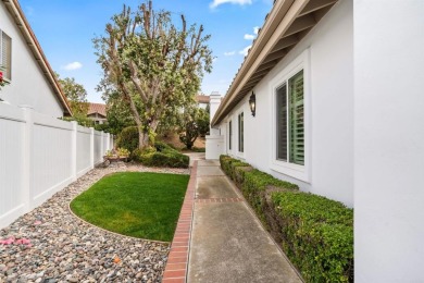 The open-concept family and dining area creates a welcoming on Ocean Hills Country Club in California - for sale on GolfHomes.com, golf home, golf lot