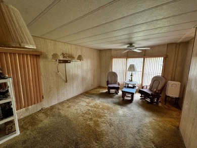 Charming 1982 Palm double-wide manufactured home located in the on Rolling Greens Executive Golf Community in Florida - for sale on GolfHomes.com, golf home, golf lot