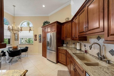 Discover your dream retreat nestled in the prestigious Cambridge on Wycliffe Golf and Country Club in Florida - for sale on GolfHomes.com, golf home, golf lot