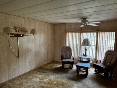 Charming 1982 Palm double-wide manufactured home located in the on Rolling Greens Executive Golf Community in Florida - for sale on GolfHomes.com, golf home, golf lot