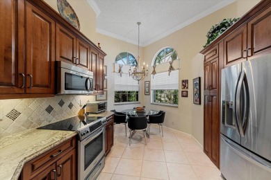 Discover your dream retreat nestled in the prestigious Cambridge on Wycliffe Golf and Country Club in Florida - for sale on GolfHomes.com, golf home, golf lot