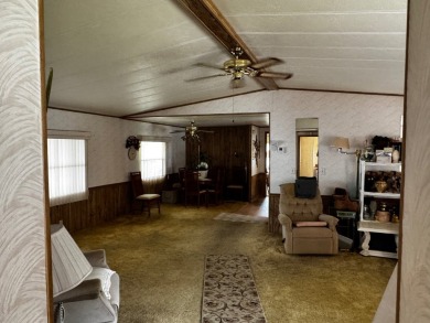 Charming 1982 Palm double-wide manufactured home located in the on Rolling Greens Executive Golf Community in Florida - for sale on GolfHomes.com, golf home, golf lot