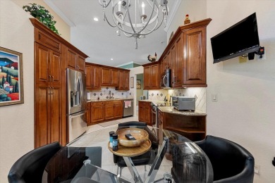 Discover your dream retreat nestled in the prestigious Cambridge on Wycliffe Golf and Country Club in Florida - for sale on GolfHomes.com, golf home, golf lot