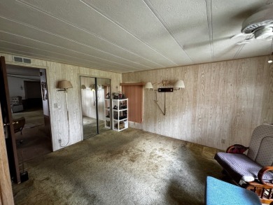 Charming 1982 Palm double-wide manufactured home located in the on Rolling Greens Executive Golf Community in Florida - for sale on GolfHomes.com, golf home, golf lot