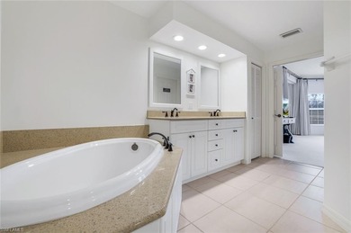 Beautifully updated, this first-floor residence in Waterford at on Bonita Bay West in Florida - for sale on GolfHomes.com, golf home, golf lot