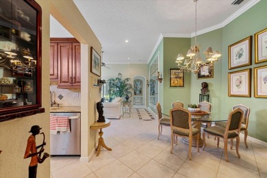 Discover your dream retreat nestled in the prestigious Cambridge on Wycliffe Golf and Country Club in Florida - for sale on GolfHomes.com, golf home, golf lot