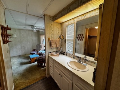 Charming 1982 Palm double-wide manufactured home located in the on Rolling Greens Executive Golf Community in Florida - for sale on GolfHomes.com, golf home, golf lot