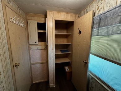 Charming 1982 Palm double-wide manufactured home located in the on Rolling Greens Executive Golf Community in Florida - for sale on GolfHomes.com, golf home, golf lot