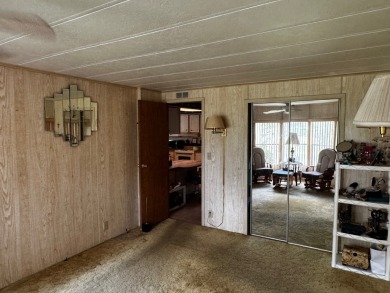 Charming 1982 Palm double-wide manufactured home located in the on Rolling Greens Executive Golf Community in Florida - for sale on GolfHomes.com, golf home, golf lot