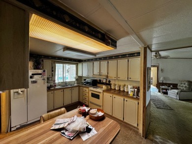 Charming 1982 Palm double-wide manufactured home located in the on Rolling Greens Executive Golf Community in Florida - for sale on GolfHomes.com, golf home, golf lot