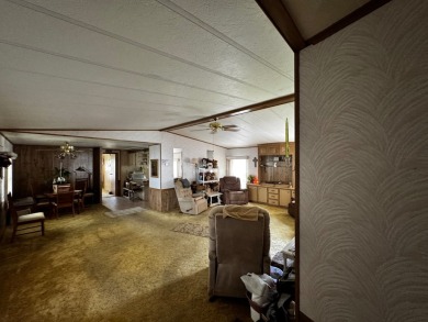 Charming 1982 Palm double-wide manufactured home located in the on Rolling Greens Executive Golf Community in Florida - for sale on GolfHomes.com, golf home, golf lot