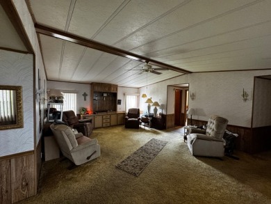 Charming 1982 Palm double-wide manufactured home located in the on Rolling Greens Executive Golf Community in Florida - for sale on GolfHomes.com, golf home, golf lot