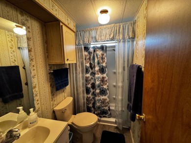 Charming 1982 Palm double-wide manufactured home located in the on Rolling Greens Executive Golf Community in Florida - for sale on GolfHomes.com, golf home, golf lot