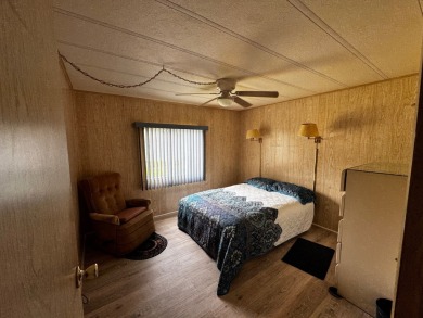 Charming 1982 Palm double-wide manufactured home located in the on Rolling Greens Executive Golf Community in Florida - for sale on GolfHomes.com, golf home, golf lot