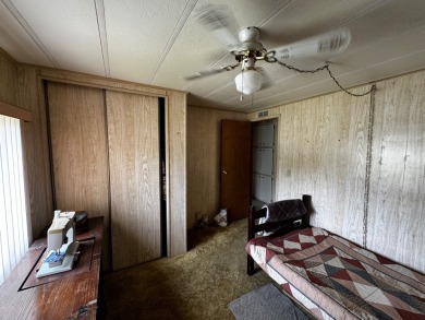 Charming 1982 Palm double-wide manufactured home located in the on Rolling Greens Executive Golf Community in Florida - for sale on GolfHomes.com, golf home, golf lot