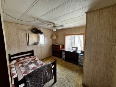 Charming 1982 Palm double-wide manufactured home located in the on Rolling Greens Executive Golf Community in Florida - for sale on GolfHomes.com, golf home, golf lot