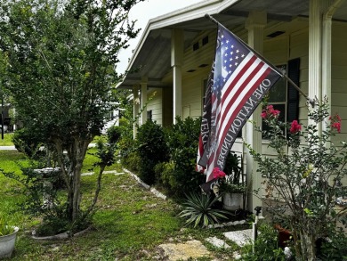 Charming 1982 Palm double-wide manufactured home located in the on Rolling Greens Executive Golf Community in Florida - for sale on GolfHomes.com, golf home, golf lot