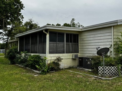 Charming 1982 Palm double-wide manufactured home located in the on Rolling Greens Executive Golf Community in Florida - for sale on GolfHomes.com, golf home, golf lot