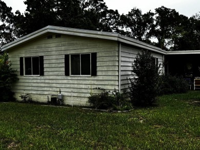 Charming 1982 Palm double-wide manufactured home located in the on Rolling Greens Executive Golf Community in Florida - for sale on GolfHomes.com, golf home, golf lot