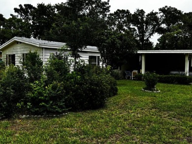 Charming 1982 Palm double-wide manufactured home located in the on Rolling Greens Executive Golf Community in Florida - for sale on GolfHomes.com, golf home, golf lot