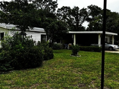Charming 1982 Palm double-wide manufactured home located in the on Rolling Greens Executive Golf Community in Florida - for sale on GolfHomes.com, golf home, golf lot