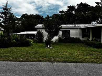 Charming 1982 Palm double-wide manufactured home located in the on Rolling Greens Executive Golf Community in Florida - for sale on GolfHomes.com, golf home, golf lot
