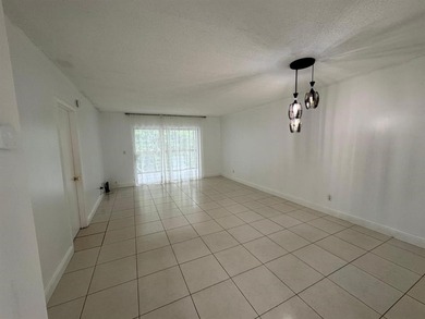 2/2 CONDOMINIUM FOR SALE IN DESIRABLE VERY ACTIVE COMMUNITY AT on Oriole Golf and Tennis Club in Florida - for sale on GolfHomes.com, golf home, golf lot
