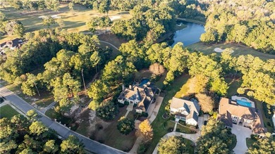 Tucked along the Rock Creek Golf Course in Fairhope, this on Rock Creek Golf Club in Alabama - for sale on GolfHomes.com, golf home, golf lot