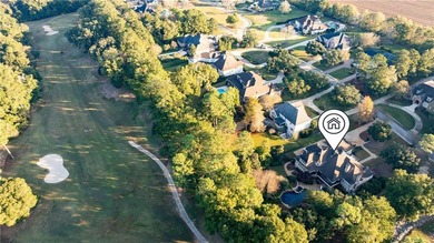 Tucked along the Rock Creek Golf Course in Fairhope, this on Rock Creek Golf Club in Alabama - for sale on GolfHomes.com, golf home, golf lot