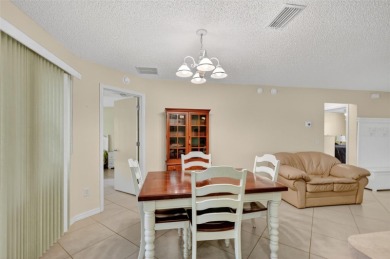 This charming 2/2 Austin Model, located in the desirable Village on The Links of Spruce Creek in Florida - for sale on GolfHomes.com, golf home, golf lot