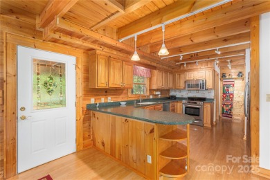 This warm and inviting, solidly built custom log home offers so on Waynesville Country Club Inn in North Carolina - for sale on GolfHomes.com, golf home, golf lot