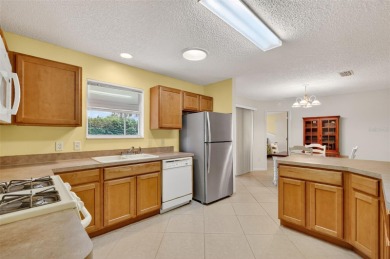 This charming 2/2 Austin Model, located in the desirable Village on The Links of Spruce Creek in Florida - for sale on GolfHomes.com, golf home, golf lot