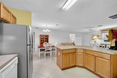 This charming 2/2 Austin Model, located in the desirable Village on The Links of Spruce Creek in Florida - for sale on GolfHomes.com, golf home, golf lot