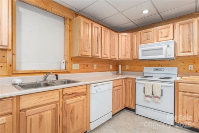 This warm and inviting, solidly built custom log home offers so on Waynesville Country Club Inn in North Carolina - for sale on GolfHomes.com, golf home, golf lot