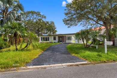 Prime location in the heart of Dunedin! 3-bedroom, 2-bath home on The Dunedin Country Club in Florida - for sale on GolfHomes.com, golf home, golf lot